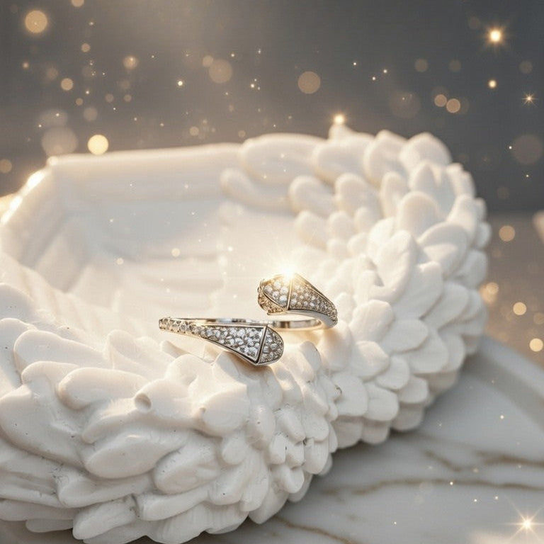 Pair of diamond earrings on a white stone surface with a soft, blurred background