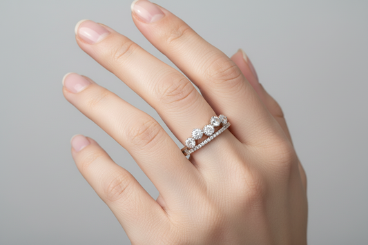 Diamond ring on a white cushion with a light gray background