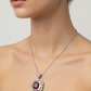 Jewelry set with red gemstones on a stone surface
