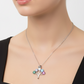 Necklace with colorful gemstones on a gray card